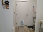 Laundry room , back door with a doggie door 
